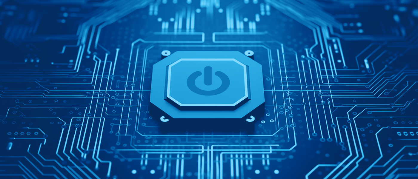 Close-up of a blue power button on a circuit board, symbolizing technology and digital innovation.