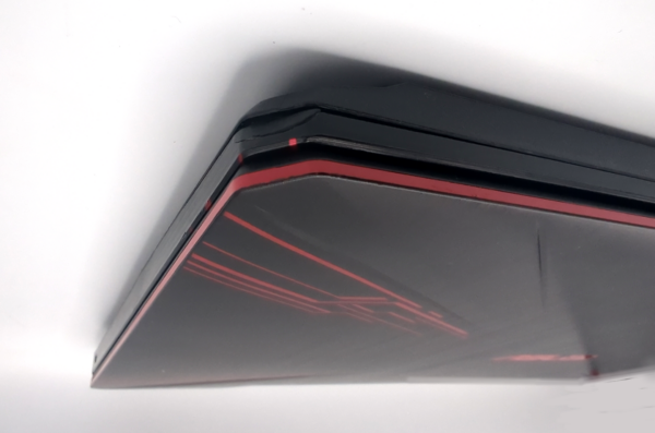Sleek black and red gaming laptop with angular design details on the lid.