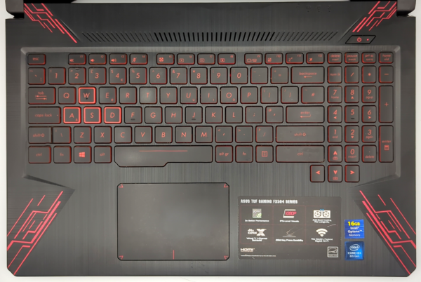 Asus TUF Gaming FX504 keyboard with red backlight and highlighted WASD keys, ideal for gaming enthusiasts.