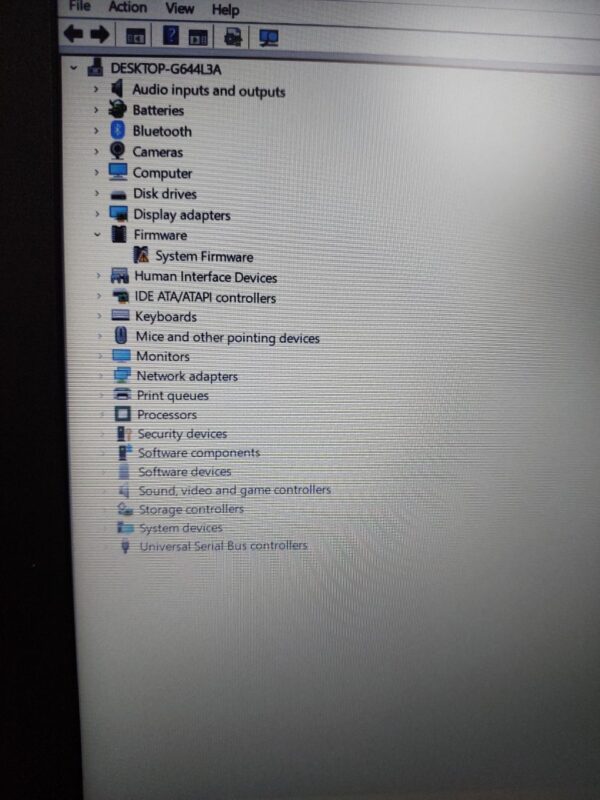 Device Manager window showing hardware components like audio, Bluetooth, cameras, and system firmware on a desktop.