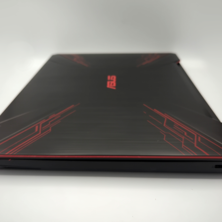 Sleek black gaming laptop with red accents and closed lid, optimized for performance and style.
