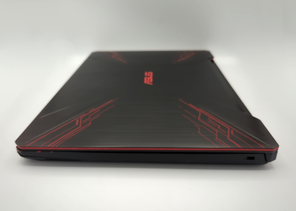 Sleek black gaming laptop with red accents and closed lid, optimized for performance and style.