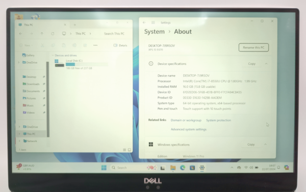Laptop screen showing Windows 11 System settings and This PC with storage details. Model: Dell XPS 13.