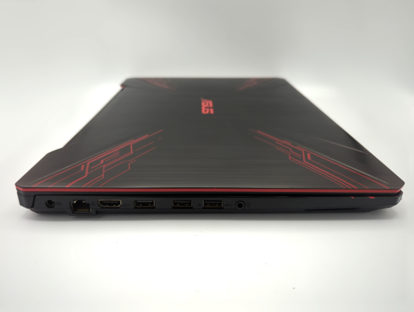 Gaming laptop showcasing ports on the side with sleek black and red design.