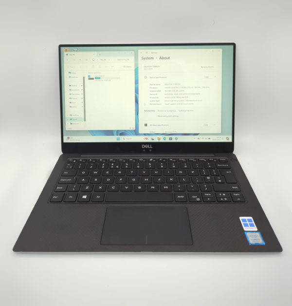 Dell laptop displaying system info with Windows 11 interface, black keyboard.