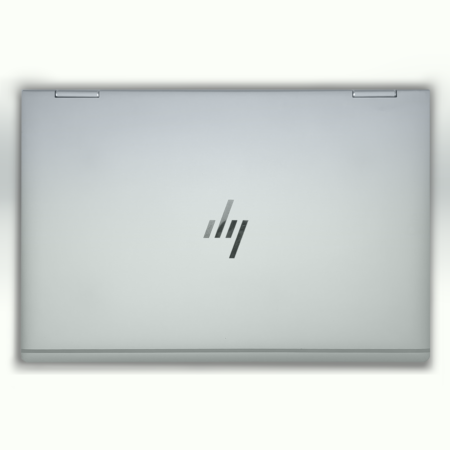 Sleek silver laptop closed, featuring a modern logo on the lid, viewed from above.