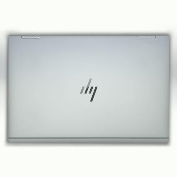 Sleek silver laptop closed, featuring a modern logo on the lid, viewed from above.