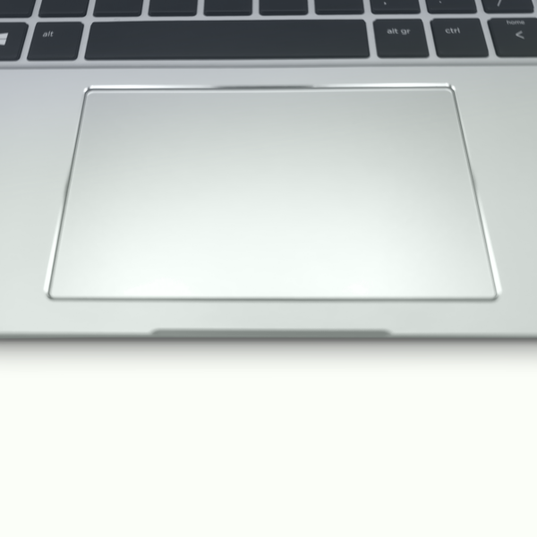 Close-up of a sleek laptop touchpad and keyboard, showcasing modern design and advanced technology.