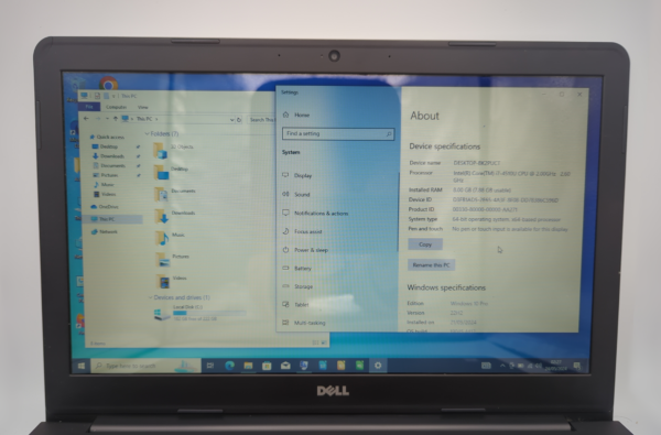 Laptop screen displaying Windows 10 device specifications and system settings.
