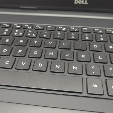 Close-up of a Dell laptop keyboard showing alphanumeric and function keys.