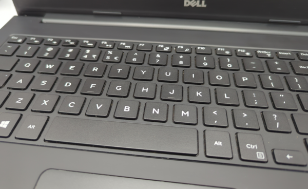 Close-up of a Dell laptop keyboard showing alphanumeric and function keys.