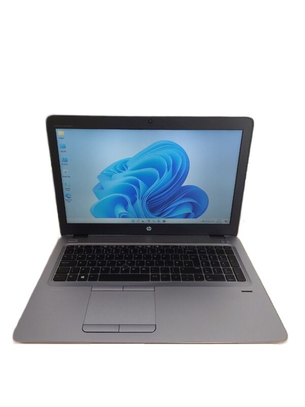 Laptop displaying a blue abstract design on the screen, featuring a black keyboard and trackpad.
