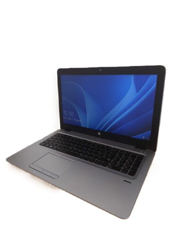 Sleek silver laptop with blue screen display on a white background, showcasing modern technology.