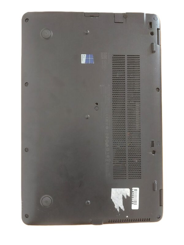 Bottom view of a laptop showing ventilation grilles and rubber feet.