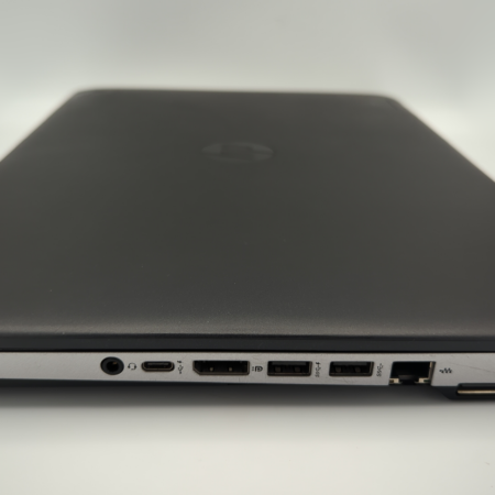Sleek black laptop with visible side ports, including USB and HDMI, on a white background.