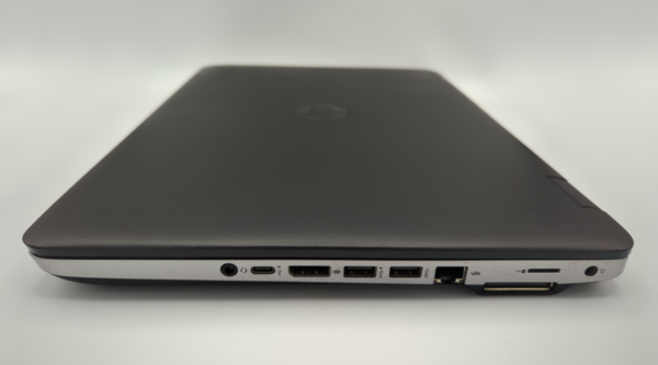 Sleek black laptop with visible side ports, including USB and HDMI, on a white background.