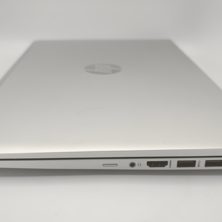 Closed silver laptop showing side ports and slim design.