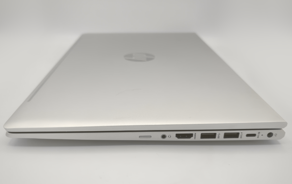 Closed silver laptop showing side ports and slim design.