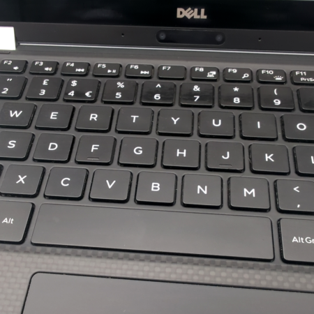 Close-up of black Dell laptop keyboard featuring QWERTY layout with function keys and symbols.