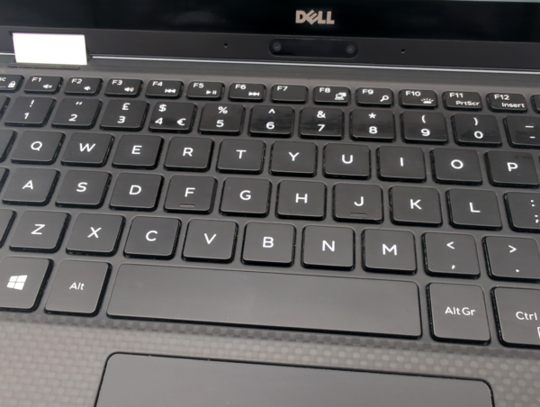 Close-up of black Dell laptop keyboard featuring QWERTY layout with function keys and symbols.