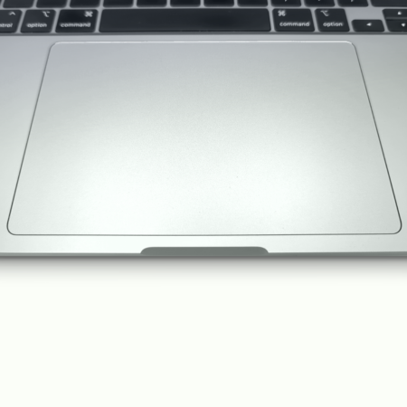 Close-up of a laptop trackpad and keyboard, highlighting sleek design and modern technology.