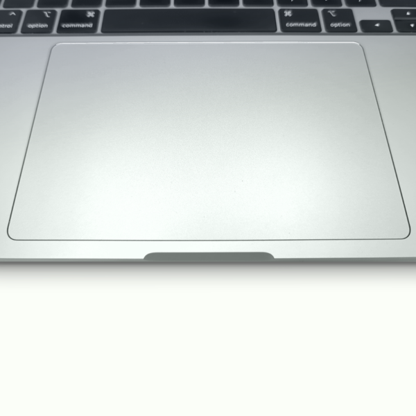 Close-up of a laptop trackpad and keyboard, highlighting sleek design and modern technology.