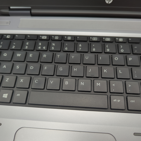 Laptop keyboard close-up showing black keys with white lettering.