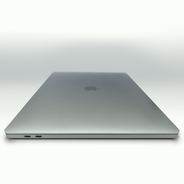 Sleek silver laptop closed on a white background, showcasing its minimalist design and compact profile.