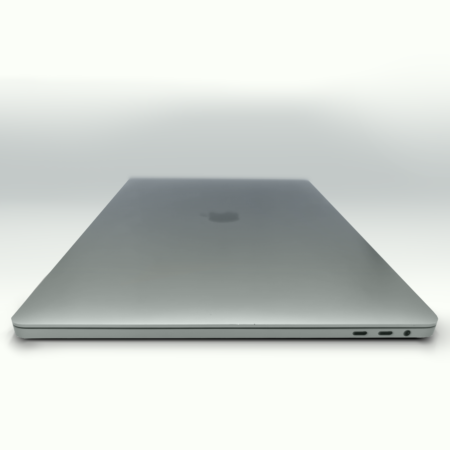 Closed silver laptop on white background, showcasing a sleek design with visible ports on the side.