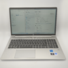 Silver laptop with Windows 11 displayed, featuring a keyboard.