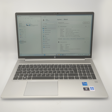 Silver laptop with Windows 11 displayed, featuring a keyboard.