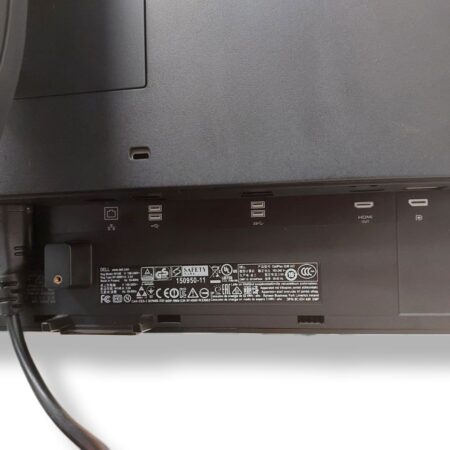 Back of a Dell monitor showing connectivity ports and safety certification labels.