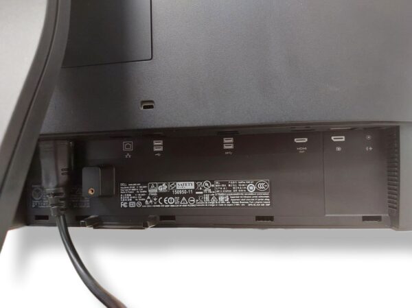 Back of a Dell monitor showing connectivity ports and safety certification labels.