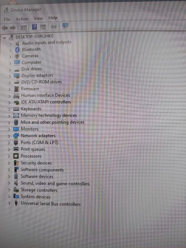 Windows Device Manager showing a list of computer hardware categories and devices.
