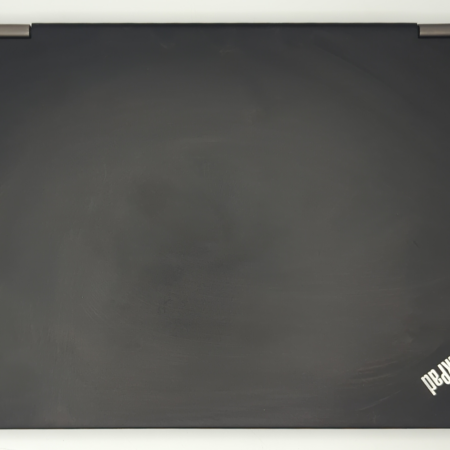 Black ThinkPad laptop cover with logo on a white background. Minimalist tech design.