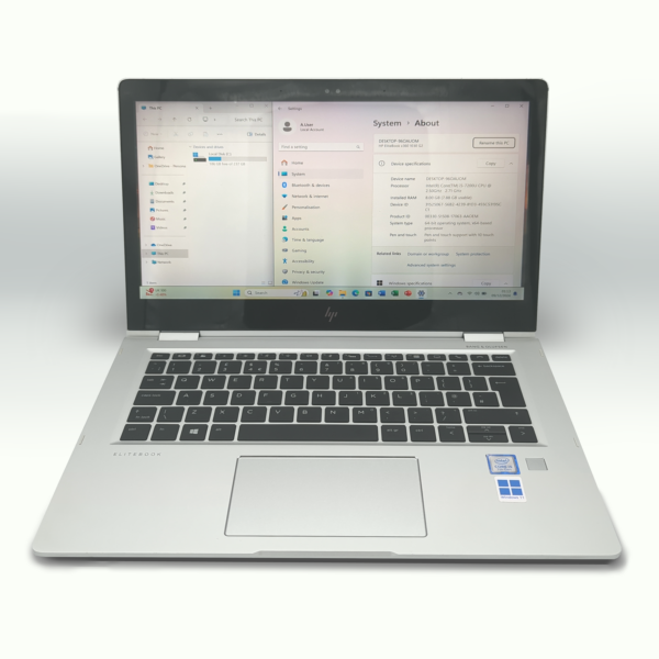 Silver HP laptop with an open screen displaying Windows system settings.