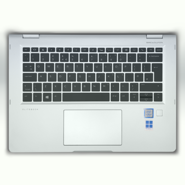 Silver laptop keyboard with Intel Core i5 and Windows 11 stickers, top view.