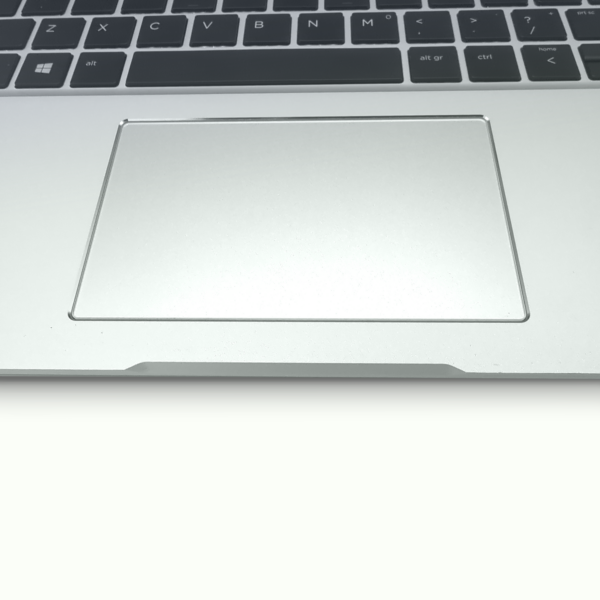 Close-up of a silver laptop touchpad and keyboard, highlighting the sleek design and modern functionality.