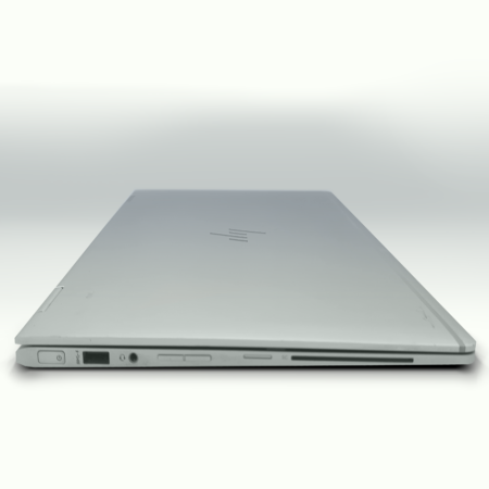 Sleek silver laptop closed, showcasing slim profile with side ports visible, against a white background.