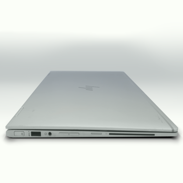 Sleek silver laptop closed, showcasing slim profile with side ports visible, against a white background.