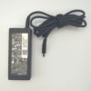 Laptop power adapter with label details and attached cord, placed on a white background.