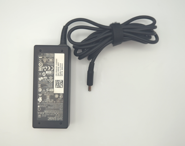 Laptop power adapter with label details and attached cord, placed on a white background.