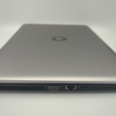 Slim silver laptop showing side ports including HDMI and USB on a white background.