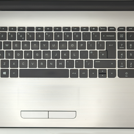 Laptop keyboard with numeric keypad, Windows 11 and Intel Core i5 stickers, silver finish.