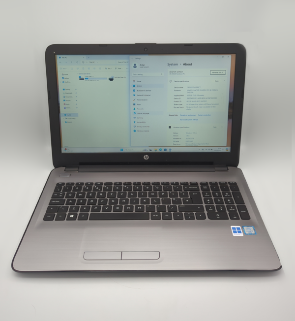 HP laptop displaying Windows system information on screen.