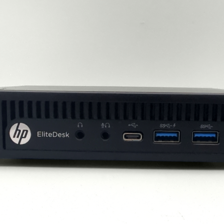 HP EliteDesk mini desktop with USB and audio ports on display.