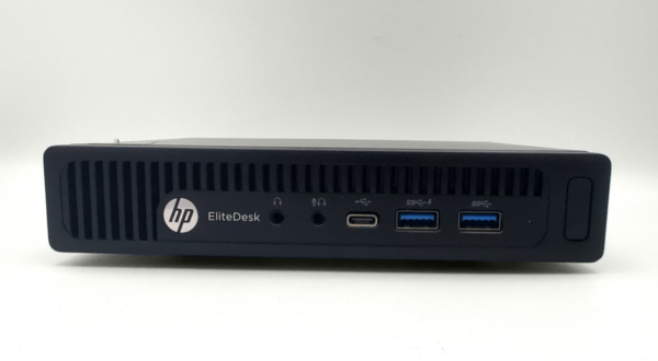 HP EliteDesk mini desktop with USB and audio ports on display.