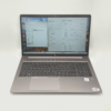 Open HP laptop displaying Windows system information on screen.