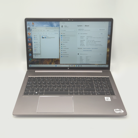 Open HP laptop displaying Windows system information on screen.