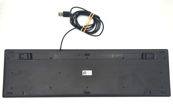 Back view of a black Dell keyboard with attached USB cable, placed on a white background.